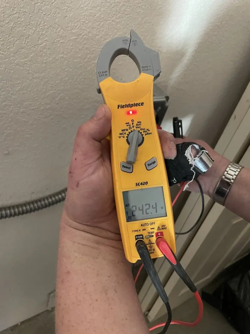Voltage testing with clamp meter during Electrical Installation Services in Security-Widefield